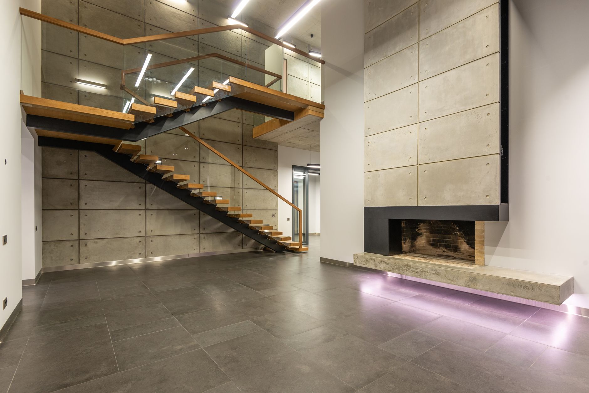Contemporary interior design of hallway in modern minimalist style house with gray stone tile floor and in Riverside, CA